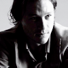gunpowdergelatine: Half in shadow, looking up; sincerity, vulnerability. (♣7/got me on my knees)