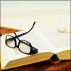 hazel: (glasses on book)