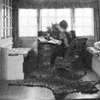 auguris: black and white photo of a woman sitting in her writing room (stayintheroom)