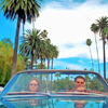 wendelah1: Two people in a convertible, palm trees in the background (I love LA)