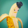 annaham: A banana in front of a light blue background with eyes, a mouth, and a little top hat. (banana tophat//timepunching (LJ))