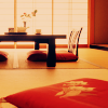 very_improbable: a low table with floor seats and a Japanese screen (red room)