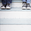 gandaki: two pairs of chucks on a step (shoes)