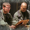 abyssinia: Daniel reads an alien newspaper while Teal'c looks on (SG1 - Teal'c's on Daniel duty)