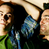 jenna_marianne: Stiles and Derek of Teen Wolf smiling at each other (Teen Wolf: Derek/Stiles smiling)