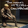 abyssinia: Cam gating onto a ship, crouching with gun, words "the name's Mitchell, Cam Mitchell" (SG1 - Cam - name's Mitchell)