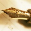 ivoryandhorn: The ornate nib of a fountain pen against a sheet of paper. (gen: fountain of words)