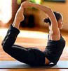 inkstone: a woman in bow pose (yoga)