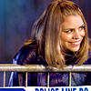 crosseduniverses: Rose grinning over a police barrier (Default)