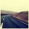 linzer: photo of a road curving around a hill (road)
