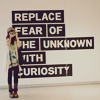 delight: girl with camera; text "replace fear of the unknown with curiosity" (see you later innovator)