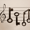 syntheid: [img] treble clef drawn on paper with old-fashioned keys laid out to look like notes (music speaks where words fail)