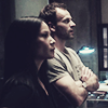 scintilla10: Joan & Sherlock stare pensively at Evidence (Elementary - Joan + Sherlock)