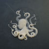 quillori: cameo portraying a head in profile which forms the body of an octupus, the tentacles writhing out from the shoulders (theme: fanfic (cameo tentacles))
