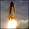 esteefee: space shuttle taking off, flurries of flame bursting from the tail (shuttle)