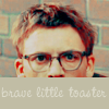 esteefee: RayK in glasses peeking over the caption -brave little toaster- (toaster)