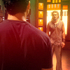 esteefee: Ronon in the background standing in the glow of Atlantis- stained glass facing John in the foreground. Johns shoulders are very broad. (ronon_and_john)