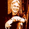 esteefee: Mark Harmon sitting against a cabin wall and grinning huge. (jethro)