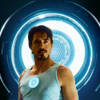 esteefee: Tony in tank top with arc reactor standing in front of a larger arc reactor. (avengers)