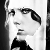 rhi: Natasha in black and white. face on in front of pic, profile in background (Natasha)