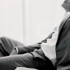 freeholding: John Marcone, in a deep, lazy sprawl across a chair. (lazy sexy sprawl)