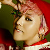 yabamena: G-dragon holding mistletoe while wearing a red cap and holiday sweater in front of a green background. ([kpop] gd - mistletoe.)