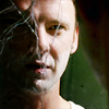 petra: Man with half his face obscured by a cracked mirror (Sam - Half crazy)