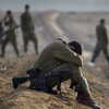 hagar_972: A soldier sitting with his head between his knees at sunrise (Addendum to the Vision of Peace)