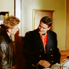 frausorge: Ray Kowalski in a leather jacket and Benton Fraser in a dark overcoat over his Mountie uniform, looking at each other (to drive the cold winter away)