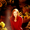 kouredios: Amy Pond, red sweater, surrounded by Vincent's sunflowers (DW!Amysunflowers)
