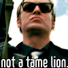 petra: Gene Hunt in sunglasses, with a gun, scowling. Text: Not a tame lion. (Gene - Not a tame lion)