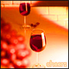 annotated_em: wineglasses with grapes, captioned "cheers" (drunk)