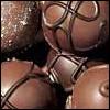 annotated_em: closeup of chocolate truffles. (chocolate)