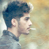 ext_1329685: Zayn Malik from One Direction smoking a cigarette in a leather jacket (1d - so i can feel happier)