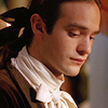 did_i_say_percy: Charlie Cox (Casanova 2005) with hair very neat in black bow, looking down, shy (nervous)