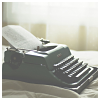 untonuggan: typewriter on a table, faded (writing)