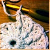northern: Detail of a "Sunny Spread" square in progress. Crochet, white yarn. (crochet)