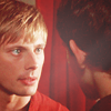 prince: Arthur leans in to speak to Merlin, intense. (Ⓜ keeping the stars apart)