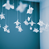 ofearthandstars: Paper cranes hanging from a blue ceiling (cranes)