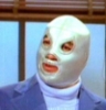 el_enmascarado_de_plata: Santo in a silver full face Spandex mask, medium blue sport coat, and light blue or white turtleneck (most badass turtleneck in the world (col)