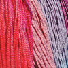 cadenzamuse: Vertical skeins of yarn in various red and pink colorways (knit: colorways)