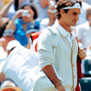 panda: photo of Roger Federer entering a match at Wimbledon, wearing all white (tennis: walk of a champion)
