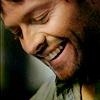 kairia: Castiel, a character from Supernatural, smiling with his eyes closed (Castiel - bent and broken)
