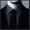 mr_gent: close-up of person (only neck & chin visible) wearing a grey shirt, black suit and black tie (Default)