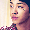 actionreaction: photo of lee gikwang looking to the side. he has eyeliner and two small black teardrops by his eye ([characters] naj)