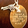 recessional: necklace with a pistol charm and a flat charm reading "I keep a close watch on this heart of mine." (personal; outrun my brother)