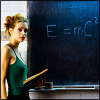 grey_gazania: a blonde woman in a green tank top with a book beside a blackboard that reads 'e=mc squared' (the destroyer of worlds)