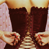vae: woman lacing a corset behind her back (kink: corset lacing)