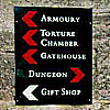 jessie_c: Sign pointing to various horrible things in a castle and then pointing out where the gift shop is. (dungeon/gift shop)