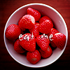 shopfront: Source: non-specified. Bowl of strawberries. Text: eat me. (Food - mmm strawberries for dessert)